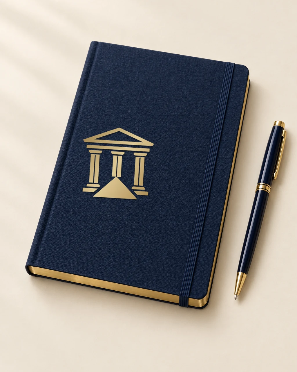 Navy Legal Pathways notebook with a gold emblem and a matching navy and gold pen